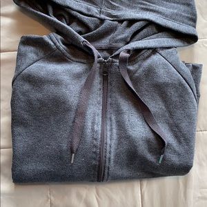 Loose fitting zip up hoodie.